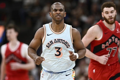 FILE - San Antonio Spurs guard Chris Paul (3) celebrates a basket during the second half of an NBA basketball game against the Toronto Raptors, April 13, 2025, in San Antonio. (AP Photo/Darren Abate, File)