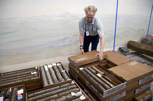Geologist James Hagadorn closes boxes of core rock samples at the Denver Museum of Nature & Science on July 9, 2025. (AP Photo/Thomas Peipert)