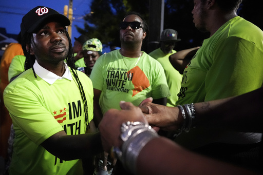 District of Columbia councilmember elect Trayon White, left, shakes hands with a supporter as he arrives to his Ward 8 special election watch party, Tuesday, July 15, 2025, in Washington. (AP Photo/Julia Demaree Nikhinson)
