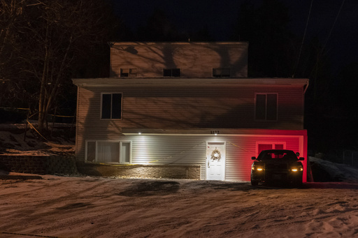 FILE - A private security officer sits in a vehicle, Jan. 3, 2023, in front of the house in Moscow, Idaho, where four University of Idaho students were killed in November, 2022. (AP Photo/Ted S. Warren, File)