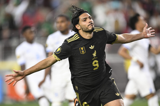 Mexico forward Raúl Jiménez (9) celebrates scoring his team's first goal during the second half of a CONCACAF Gold Cup semifinal soccer match Wednesday, July 2, 2025, in Santa Clara, Calif. (AP Photo/Eakin Howard)