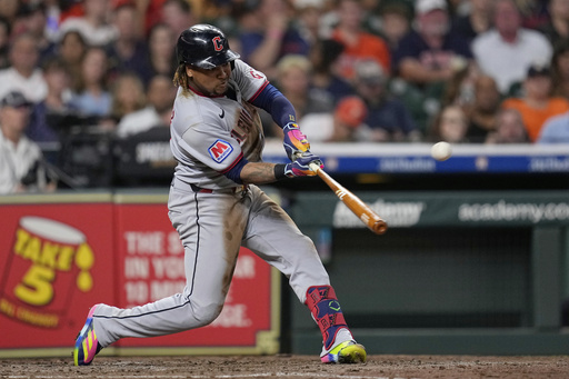 Cleveland Guardians' José Ramírez hits a three-run home run against the Houston Astros during the fifth inning of a baseball game Monday, July 7, 2025, in Houston. (AP Photo/David J. Phillip)