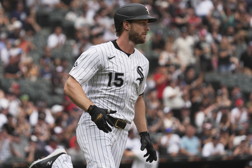 Chicago White Sox's Austin Slater runs after hitting a one-run single during the fifth inning of a baseball game against the Cleveland Guardians in Chicago, Sunday, July 13, 2025. (AP Photo/Nam Y. Huh)