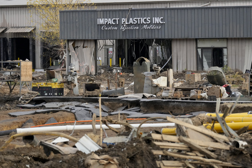 FILE - Debris lays in front of Impact Plastics Inc. in Erwin, Tenn., Nov. 22, 2024. (AP Photo/George Walker IV, File)