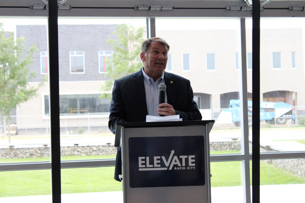 U.S. Sen. Mike Rounds, R-South Dakota, speaks Aug. 12, 2024, at the David Lust Accelerator Building in Rapid City about federal housing funds awarded to the Black Hills area. (Seth Tupper/South Dakota Searchlight)