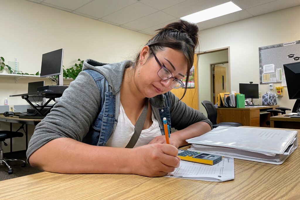 Autumn Tree Top works on a math problem on July 17, 2025, at the Career Learning Center of the Black Hills in Rapid City. (Seth Tupper/South Dakota Searchlight)