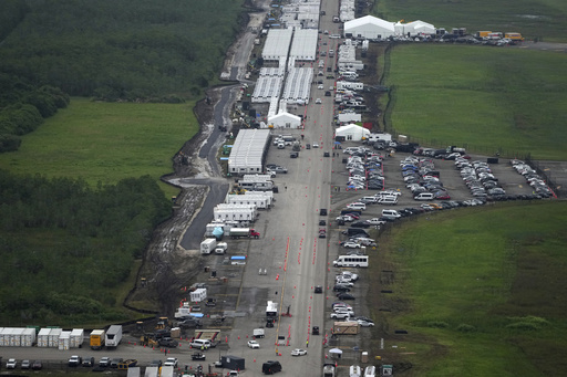 Work progresses on a new migrant detention facility dubbed "Alligator Alcatraz," at Dade-Collier Training and Transition facility in the Florida Everglades, Friday, July 4, 2025, in Ochopee, Fla. (AP Photo/Rebecca Blackwell)