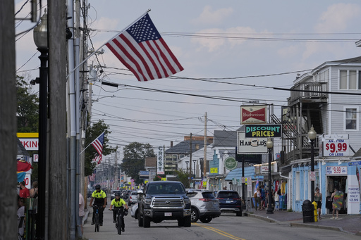 Community Service Officers from the Old Orchard Beach Police Dept. patrol on bicycles, Tuesday, July 29, 2025, in Old Orchard Beach, Maine. (AP Photo/Robert F. Bukaty)