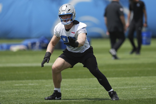 FILE - Detroit Lions defensive end Aidan Hutchinson runs a drill during an NFL football practice in Allen Park, Mich., May 30, 2025. (AP Photo/Paul Sancya, file)