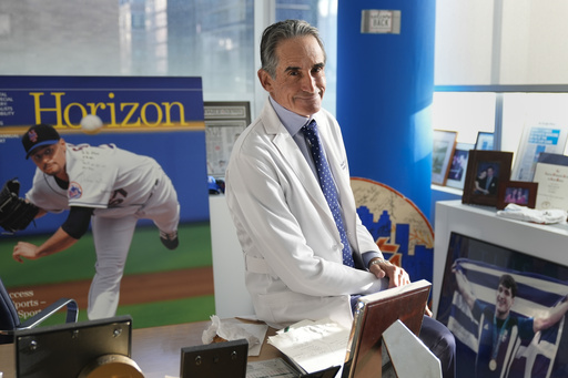 Dr. David Altchek poses in his office filled with sports memorabilia in New York, Thursday, Feb. 29, 2024. (AP Photo/Seth Wenig, File)