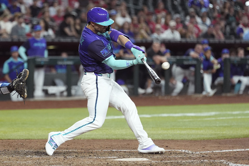Arizona Diamondbacks' Randal Grichuk connects for an inside-the-park home run against the Kansas City Royals during the eighth inning of a baseball game Saturday, July 5, 2025, in Phoenix. (AP Photo/Ross D. Franklin)