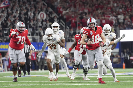 FILE - Ohio State quarterback Will Howard (18) runs against Texas during the second half of the Cotton Bowl College Football Playoff semifinal game, Jan. 10, 2025, in Arlington, Texas. (AP Photo/Julio Cortez, File)