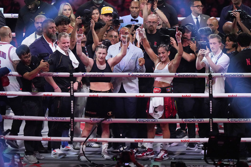 Ireland's Katie Taylor, left, and Puerto Rico's Amanda Serrano pose after a super lightweight championship boxing match Saturday, July 12, 2025, in New York. (AP Photo/Frank Franklin II)