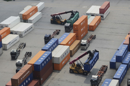 Cranes and shipping containers are seen at a port in Pyeongtaek, South Korea, Tuesday, July 8, 2025. (AP Photo/Ahn Young-joon)