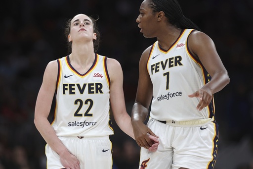 Indiana Fever's Caitlin Clark (22) reacts with a possible injury beside Aliyah Boston (7) during the second half of a WNBA basketball game against the Connecticut Sun, Tuesday, July 15, 2025, in Boston. (AP Photo/Michael Dwyer)