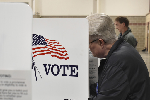 FILE - A voter fills out a ballot at the MetraPark events center, June 4, 2024, in Billings, Mont. (AP Photo/Matthew Brown, FIle)