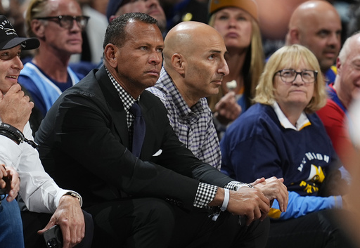 FILE - Minnesota Timberwolves minority owners Alex Rodriguez, front, and Marc Lore look on in the second half of Game 1 of an NBA basketball second-round playoff series against the Denver Nuggets, May 4, 2024, in Denver. (AP Photo/David Zalubowski, File)
