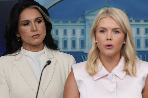 White House press secretary Karoline Leavitt speaks as Director of National Intelligence Tulsi Gabbard listens in the James Brady Press Briefing Room at the White House, Wednesday, July 23, 2025, in Washington. (AP Photo/Julia Demaree Nikhinson)