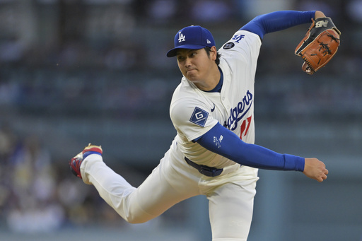 Los Angeles Dodgers pitcher Shohei Ohtani throws against the Minnesota Twins during the third inning of a baseball game in Los Angeles, Monday, July 21, 2025. (AP Photo/Jayne Kamin-Oncea)