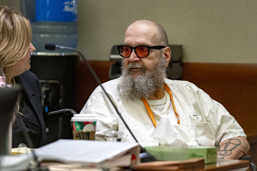 FILE - Jasmine North, federal public defender mitigation investigator, speaks with Ralph Leroy Menzies during his competency hearing in Third District Court in West Jordan, Utah, Nov. 18, 2024. (Rick Egan/The Salt Lake Tribune via AP, Pool, File)