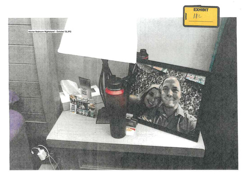 FILE - This image provided by the Fairfax County Police Department and taken on Oct. 13, 2023, was submitted as evidence in the murder case against Brendan Banfield shows a framed photo of Banfield and Juliana Peres Magalhães on his bedside table in Herndon, Va. (Fairfax County Police Department via AP, FILE)