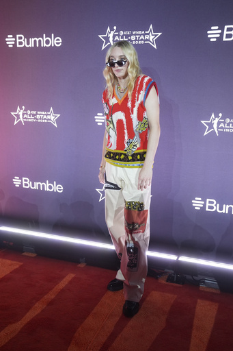 Dallas Wings' Paige Bueckers poses on the orange carpet for WNBA All Star basketball events, Thursday, July 17, 2025, in Indianapolis. (AP Photo/Darron Cummings)