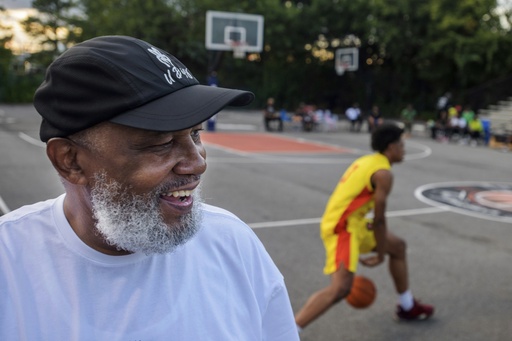 Goodman League Founder Miles Rawls poses on the court prior to the night's Goodman League basketball games Sunday, July 6, 2025, in the Barry Farm neighborhood of Washington. (AP Photo/Rod Lamkey, Jr.)
