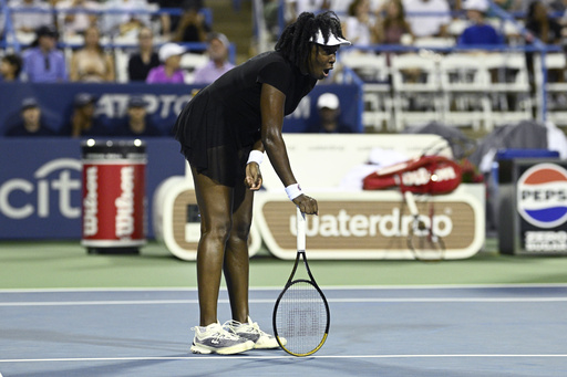 Venus Williams reacts during a match against Magdalena Frech, of Poland, at the Citi Open tennis tournament Thursday, July 24, 2025, in Washington. (AP Photo/Nick Wass)