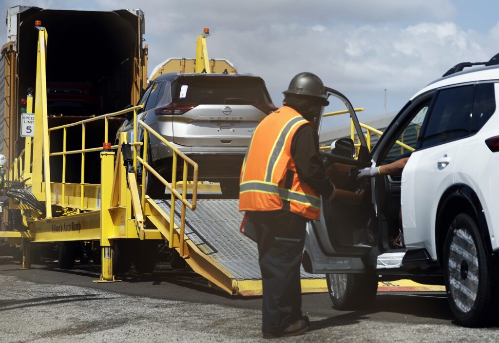 New Nissan cars are driven onto a rail car to be transported from an automobile processing terminal located at the Port of Los Angeles on April 3, 2024 in Wilmington, California. (Photo by Mario Tama/Getty Images)