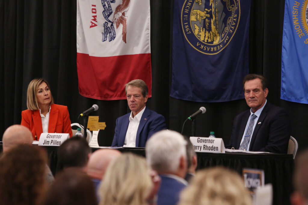 From left, Iowa's Kim Reynolds, Nebraska's Jim Pillen and South Dakota's Larry Rhoden participate in the Tri-State Governors' Conference in Dakota Dunes on Aug. 26, 2025. (Makenzie Huber/South Dakota Searchlight)