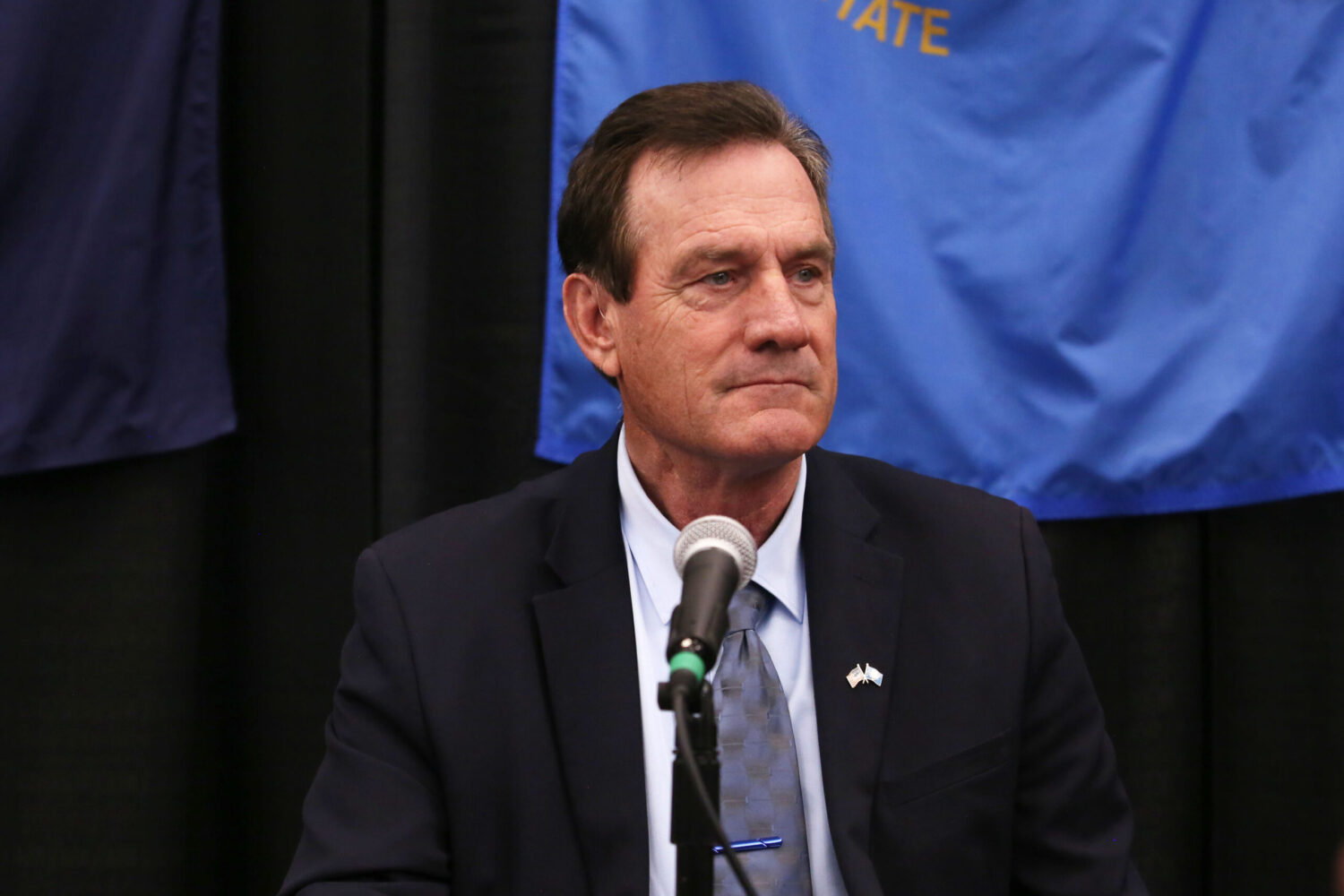 Republican South Dakota Gov. Larry Rhoden speaks to the media on Aug. 26, 2025, at the Tri-State Governors' Conference in Dakota Dunes. (Makenzie Huber/South Dakota Searchlight)