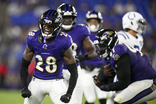 Baltimore Ravens cornerback Marquise Robinson (28) reacts after making a hit on Indianapolis Colts running back Ulysses Bentley IV, not visible, during the second half of an NFL preseason football game Thursday, Aug. 7, 2025, in Baltimore. (AP Photo/Nick Wass)
