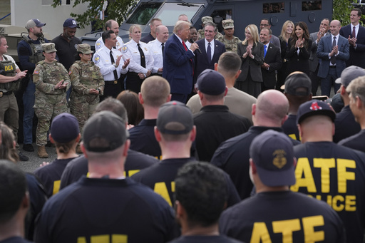 President Donald Trump speaks with members of law enforcement and National Guard soldiers, Thursday, Aug. 21, 2025, in Washington. (AP Photo/Jacquelyn Martin)