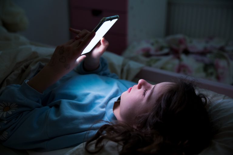 child playing on smart phone
