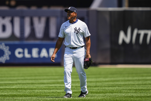Former New York Yankees' Mariano Rivera plays during the first inning of the Yankees Old-Timers' Day Game before a baseball game against the Houston Astros, Saturday, Aug. 9, 2025, in New York. (AP Photo/Yuki Iwamura)