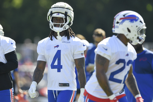 Buffalo Bills running back James Cook (4) walks on the field during practice at the team’s NFL football training camp, Wednesday, July 23, 2025, in Pittsford, N.Y. (AP Photo/Adrian Kraus)