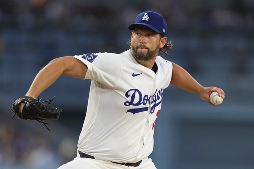 Los Angeles Dodgers starting pitcher Clayton Kershaw throws to the plate during the second inning of a baseball game against the Toronto Blue Jays, Friday, Aug. 8, 2025, in Los Angeles. (AP Photo/Mark J. Terrill)