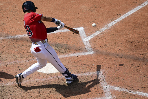 Cleveland Guardians' Steven Kwan hits a single during the fourth inning of a baseball game against the Atlanta Braves, Sunday, Aug. 17, 2025, in Cleveland. (AP Photo/David Dermer)