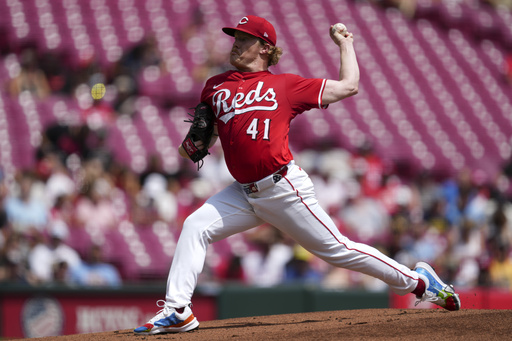 Cincinnati Reds pitcher Andrew Abbott throws in the first inning of a baseball game against the Milwaukee Brewers, Sunday, Aug. 17, 2025, in Cincinnati. (AP Photo/Grace Bradley)
