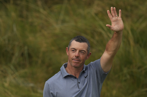 Rory McIlroy of Northern Ireland acknowledges the crowd as he walks onto the 18th green during the final round of the British Open golf championship at the Royal Portrush Golf Club, Northern Ireland, Sunday, July 20, 2025. (AP Photo/Francisco Seco)