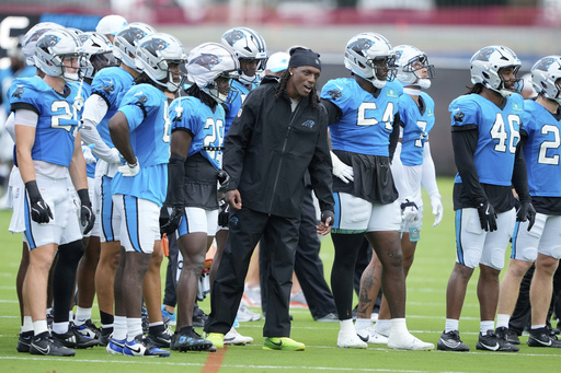 Carolina Panthers cornerback Jaycee Horn watches during an NFL football dual training camp with the Cleveland Browns Wednesday, Aug. 6, 2025, in Charlotte, N.C. Horn was involved in a car accident on his was to camp. (AP Photo/Chris Carlson)