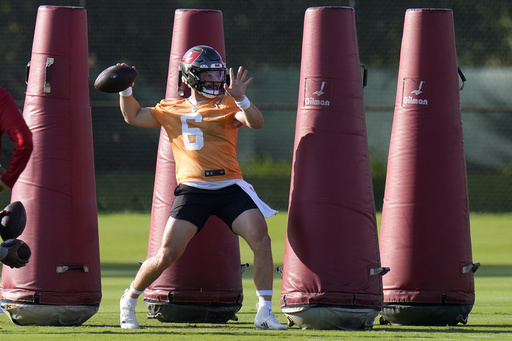 Tampa Bay Buccaneers quarterback Baker Mayfield (6) throws a pass during Back Together Weekend at an NFL football training camp practice Sunday, July 27, 2025, in Tampa, Fla. (AP Photo/Chris O'Meara)
