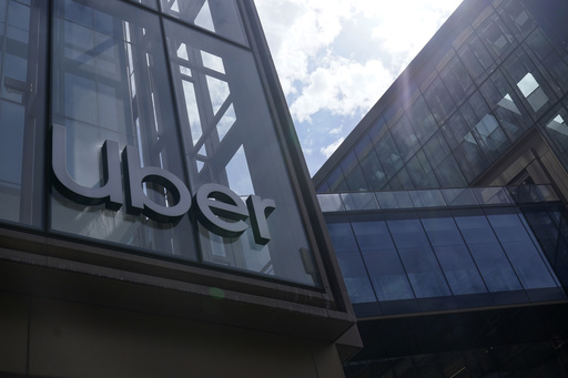 FILE - An Uber sign is displayed at the company's headquarters in San Francisco, Sept. 12, 2022. (AP Photo/Jeff Chiu, File)