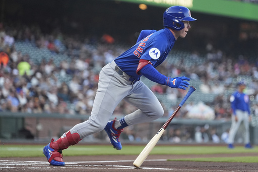 Chicago Cubs' Pete Crow-Armstrong runs to first base after hitting a single against the San Francisco Giants during the first inning of a baseball game in San Francisco, Tuesday, Aug. 26, 2025. (AP Photo/Jeff Chiu)
