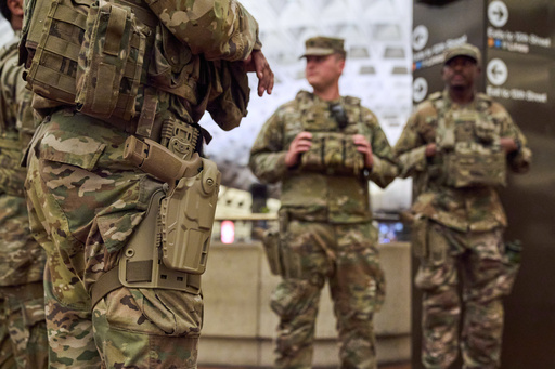 Armed members of the South Carolina National Guard patrol inside the metro system, Tuesday, Aug. 26, 2025, in downtown Washington. (AP Photo/Jacquelyn Martin)
