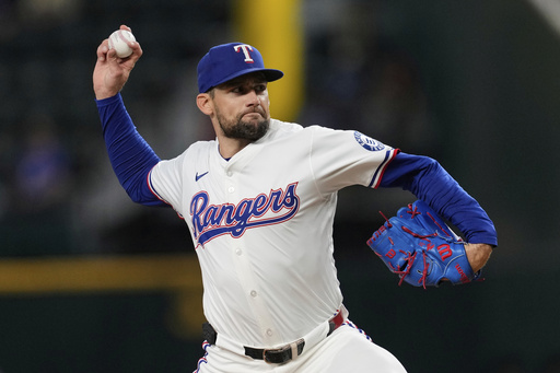 Texas Rangers starting pitcher Nathan Eovaldi throws to the Arizona Diamondbacks in the first inning of a baseball game Monday, Aug. 11, 2025, in Arlington, Texas. (AP Photo/Tony Gutierrez)