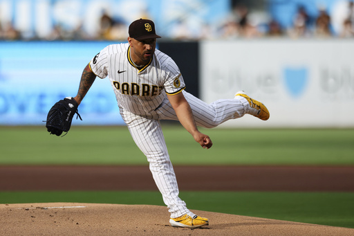 San Diego Padres' Nestor Cortes follows through on a pitch against the Los Angeles Dodgers in the first inning of a baseball game Saturday, Aug. 23, 2025, in San Diego. (AP Photo/Derrick Tuskan)