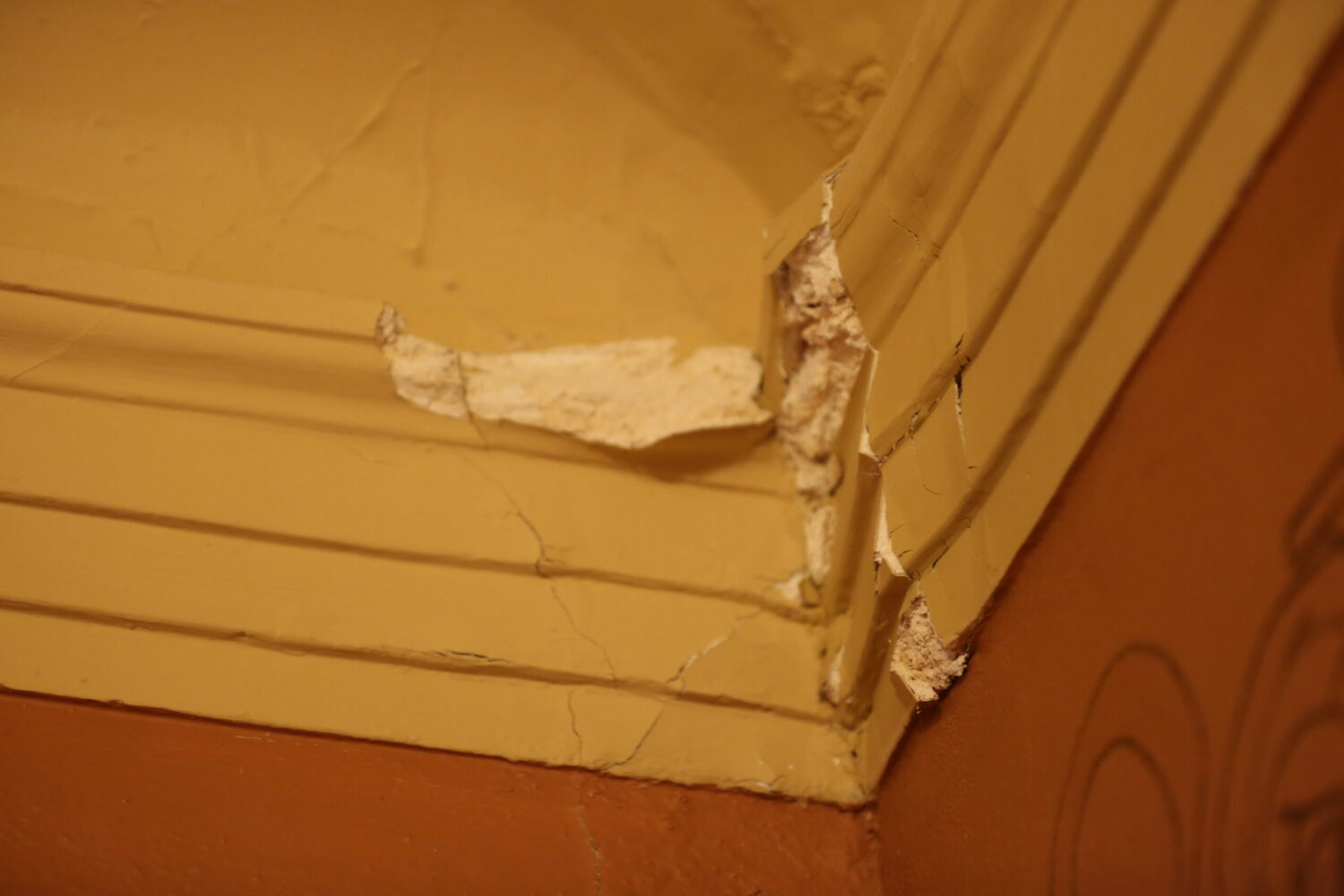 Cracked plaster in the back corner of the state House of Representatives chamber at the South Dakota Capitol in Pierre, as seen in March 2025. (Joshua Haiar/South Dakota Searchlight)