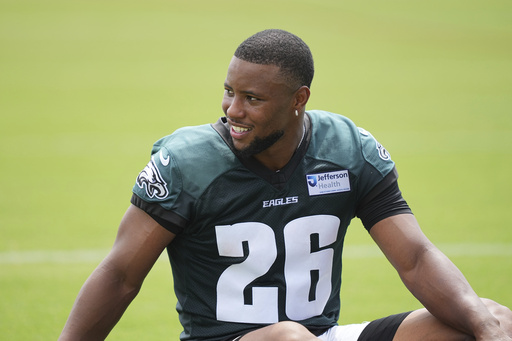 Philadelphia Eagles running back Saquon Barkley speaks waits for his turn to speak at a news conference during the team’s NFL football training camp, Wednesday, July 23, 2025, in Philadelphia. (AP Photo/Matt Rourke)