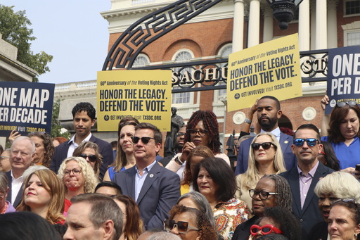 Democratic state lawmakers from across the U.S. and their supporters protest outside the Massachusetts State House on Wednesday, Aug. 6, 2025 in Boston. (AP Photo/Leah Willingham)